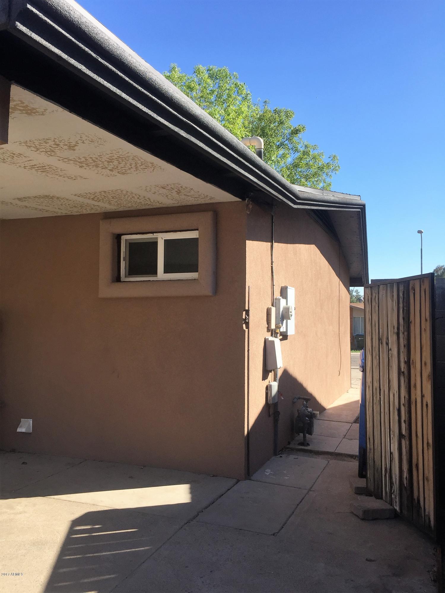 8416 West Roma Avenue Phoenix, AZ 85037 - Photo 31 of 33 a view of backyard with small cabin
