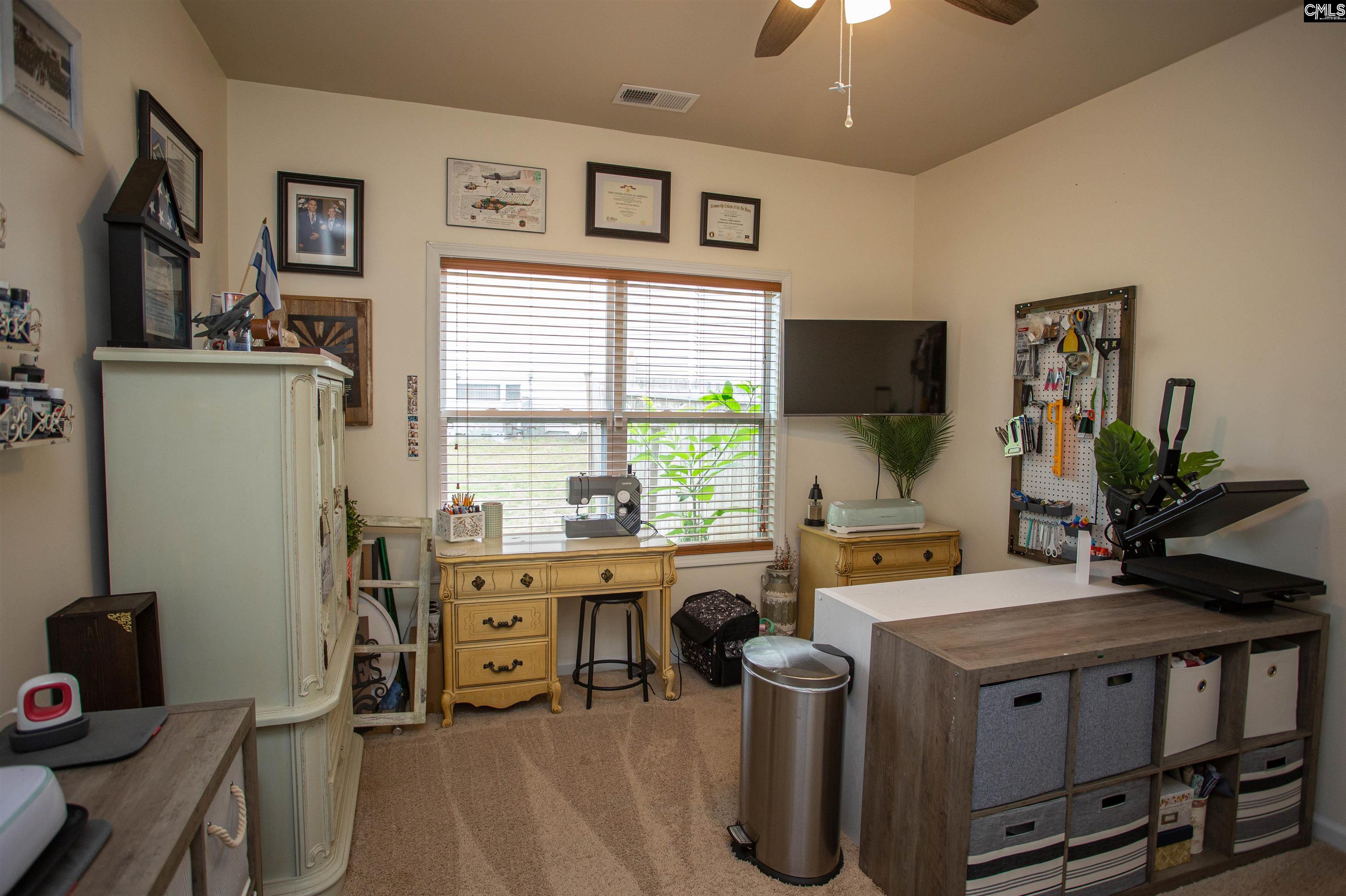 7 Templand Court Elgin, SC 29045 - Photo 22 of 47 a view of a workspace with furniture and a window