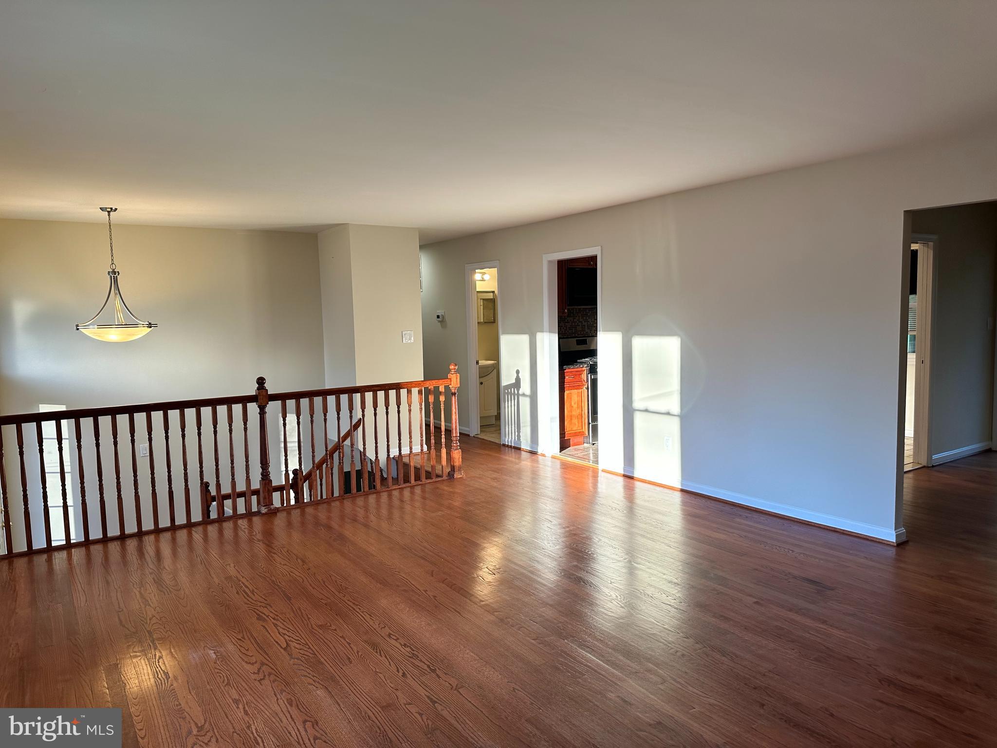 8722 Postoak Road Potomac, MD 20854 - Photo 13 of 33 Living room leads to kitchen ,3 BR & 2 full baths