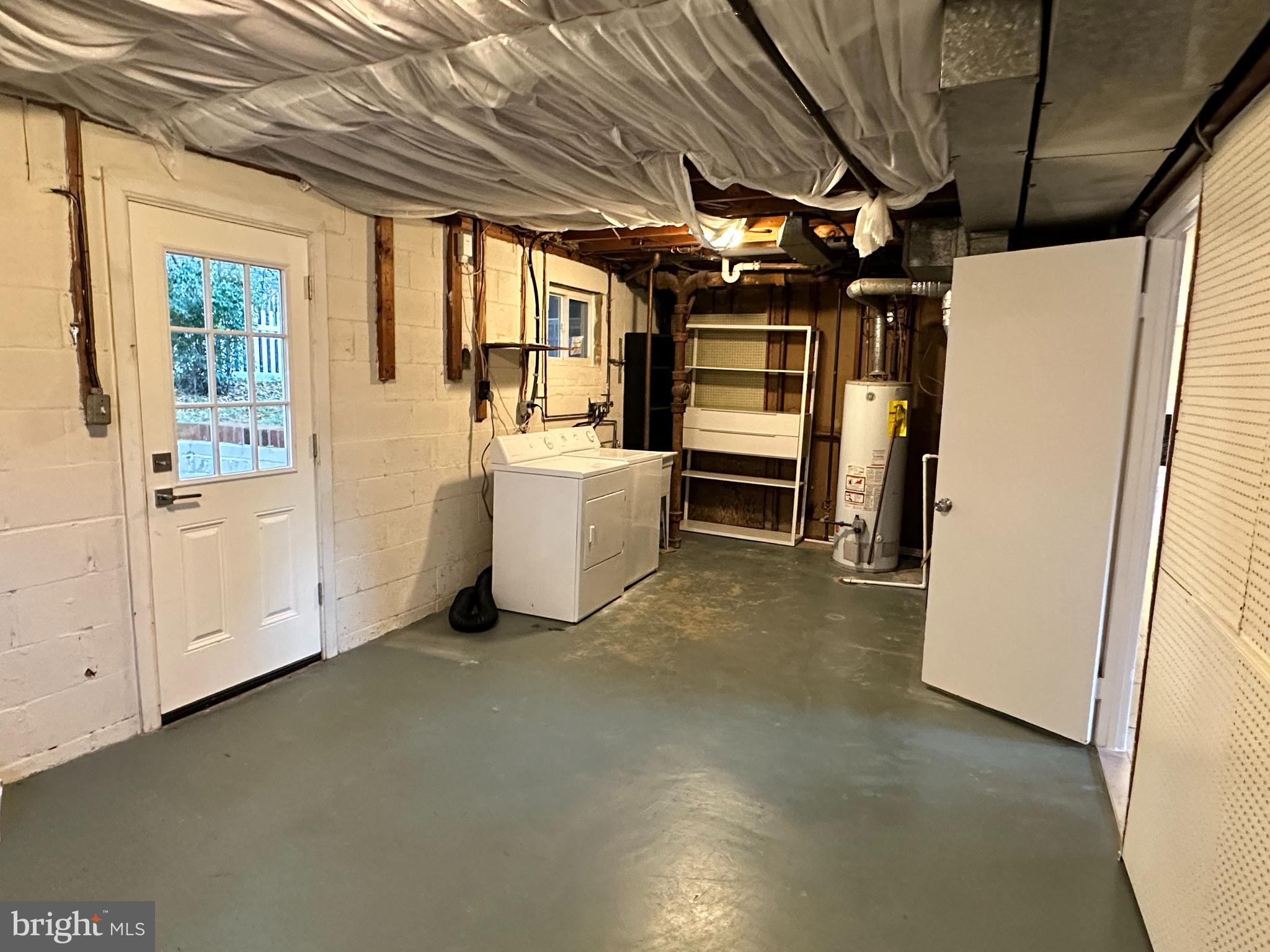 8722 Postoak Road Potomac, MD 20854 - Photo 33 of 33 Storage/Laundry and door to backyard