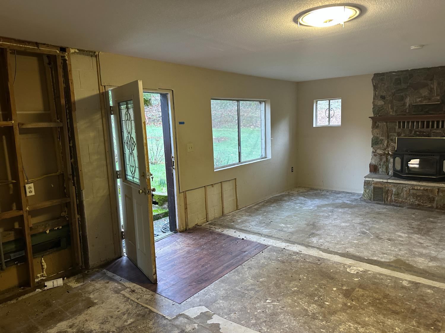 620 Schroeder Lane Colfax, CA 95713 - Photo 20 of 30 a view of an empty room with a fireplace and a window