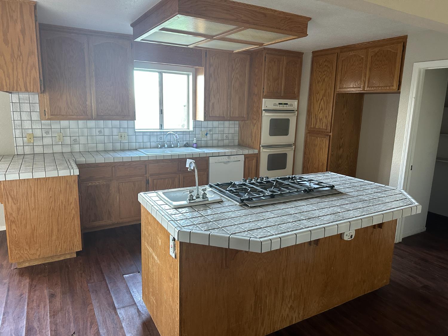 620 Schroeder Lane Colfax, CA 95713 - Photo 24 of 30 a kitchen with kitchen island stainless steel appliances a sink stove and refrigerator