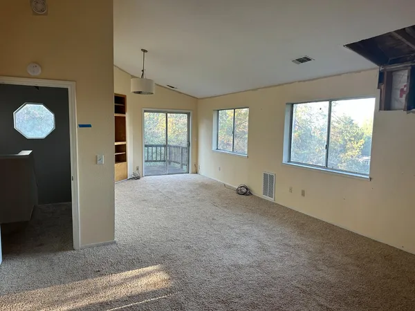 a view of an empty room with a window