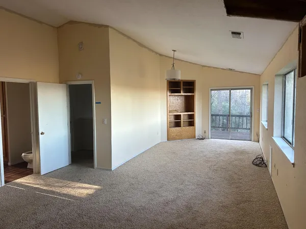 a view of empty room with windows