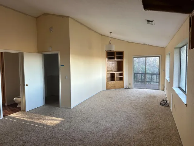 a view of empty room with windows