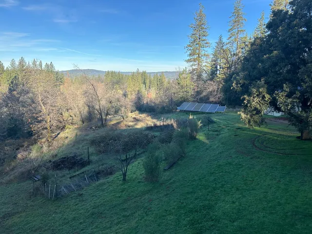 a view of a lake with a yard
