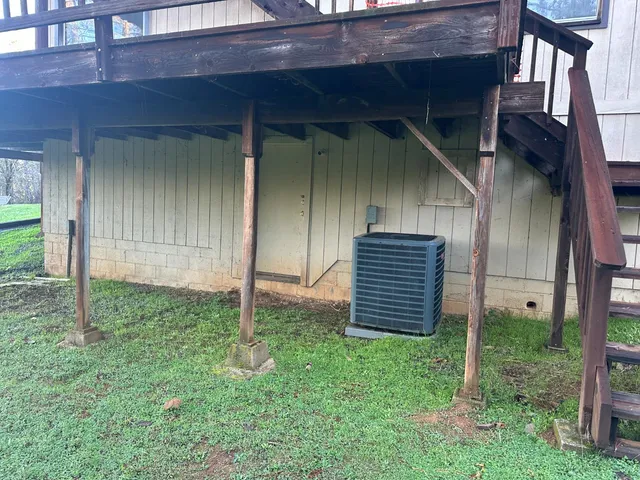 a view of house with backyard