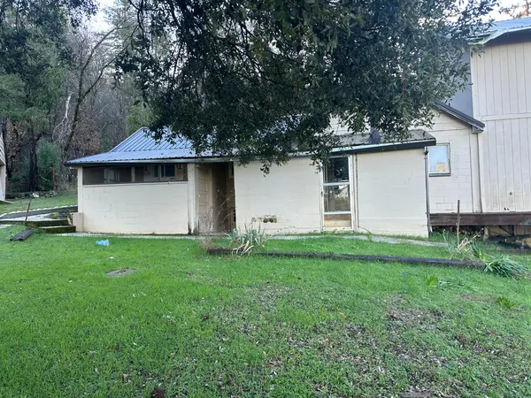 a backyard of a house with lots of green space