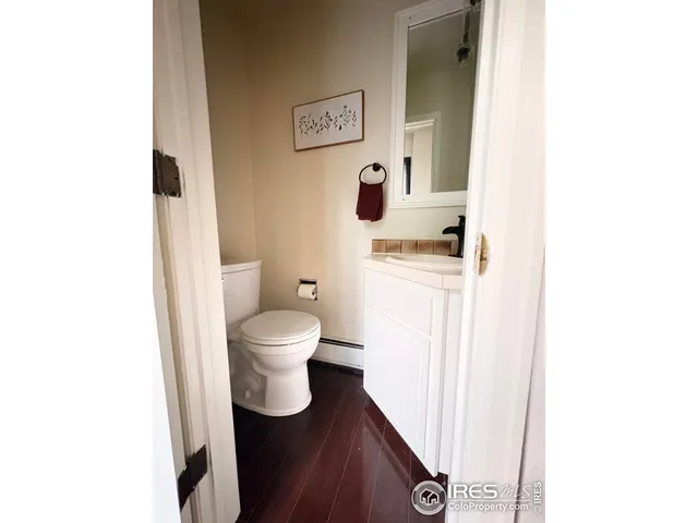 a bedroom with a bed and a mirror