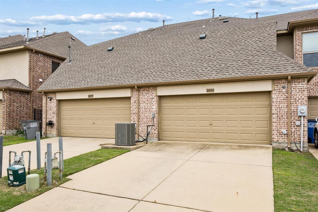2003 Downing Street Allen, TX 75013 - Photo 35 of 40 This Rear entry garage has a long driveway, too!