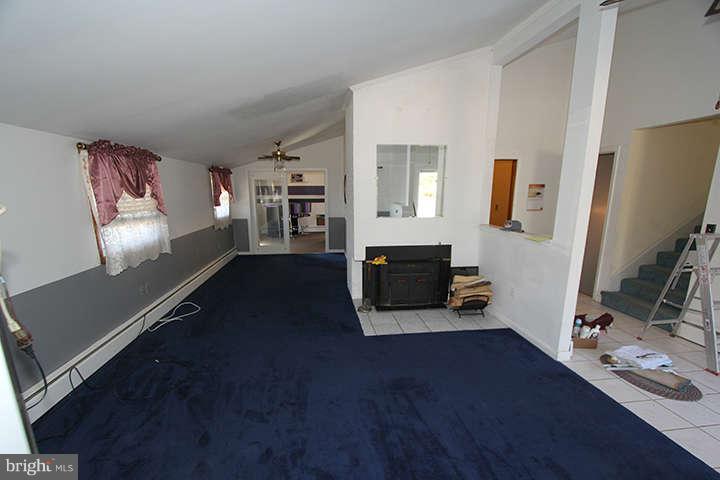 500 Whitaker Mill Road Fallston, MD 21047 - Photo 2 of 14 a living room with furniture and a flat screen tv
