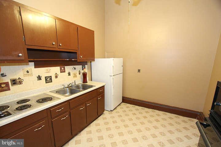 500 Whitaker Mill Road Fallston, MD 21047 - Photo 5 of 14 a kitchen with a sink a stove and refrigerator