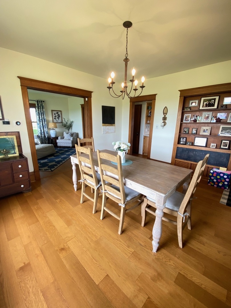174 Kilgore Road Dixon, IL 61021 - Photo 18 of 55 a living room with furniture a chandelier and a dining table
