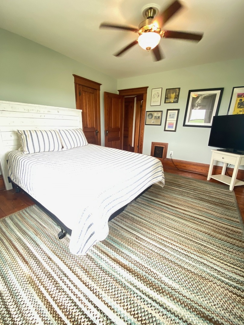 174 Kilgore Road Dixon, IL 61021 - Photo 36 of 55 a bedroom with a bed and a chandelier