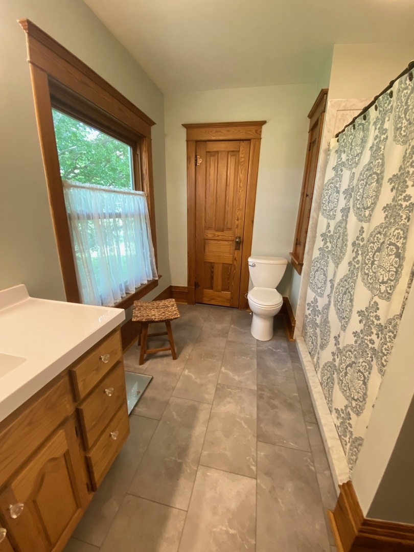 174 Kilgore Road Dixon, IL 61021 - Photo 38 of 55 a living room with a baby crib furniture and a window