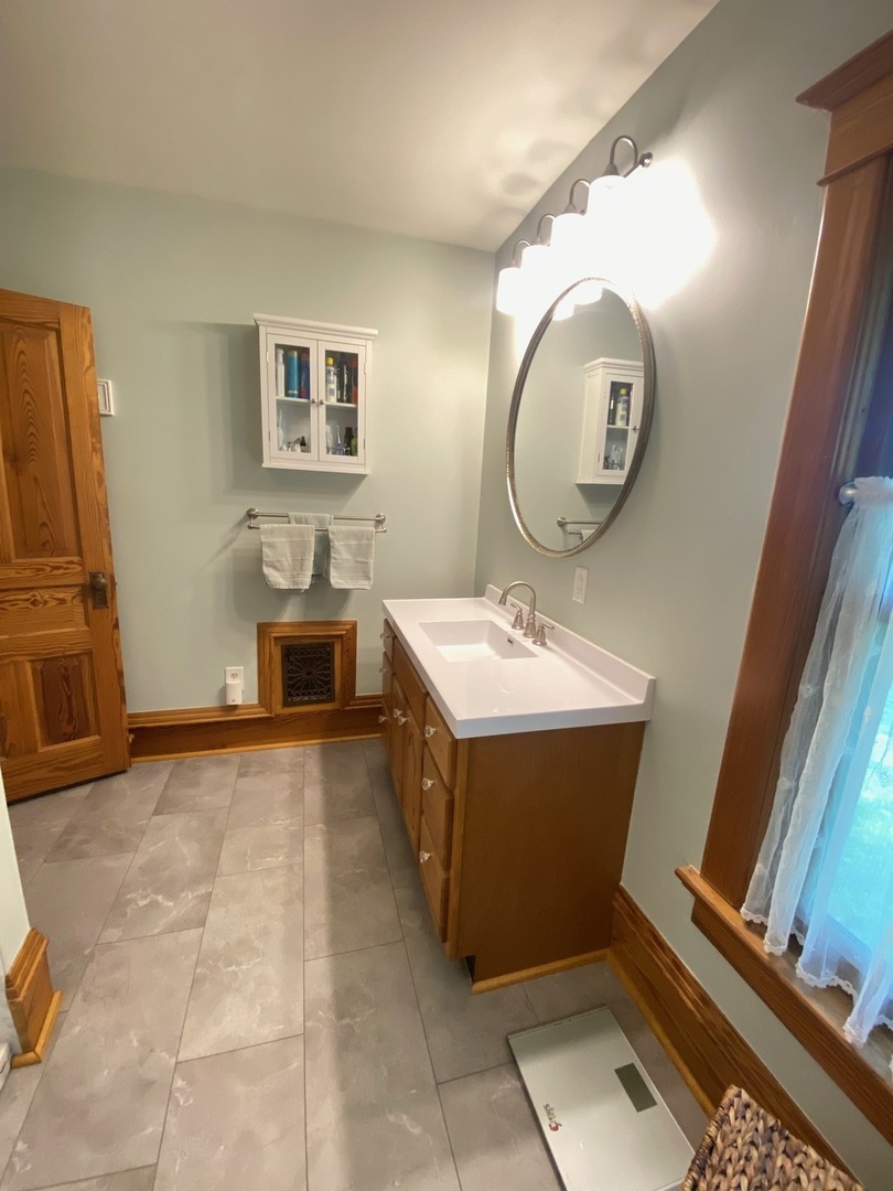 174 Kilgore Road Dixon, IL 61021 - Photo 39 of 55 a bathroom with a sink and a mirror