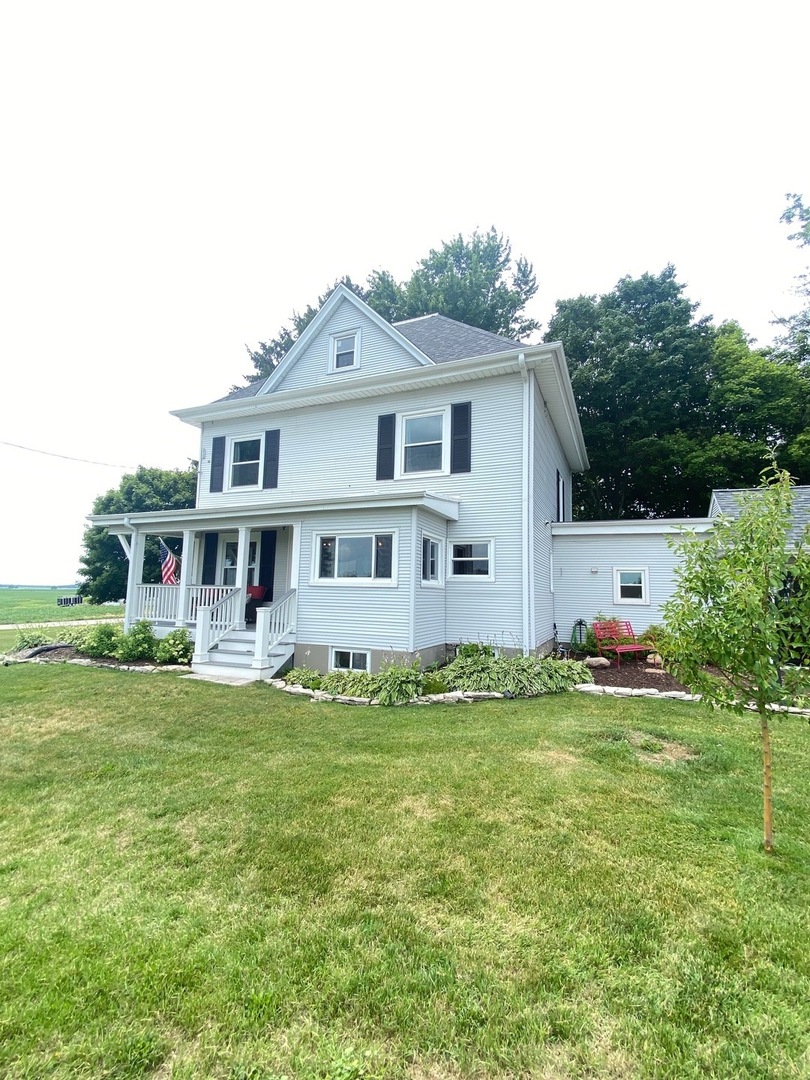 174 Kilgore Road Dixon, IL 61021 - Photo 55 of 55 a view of a house with a big yard potted plants and large tree