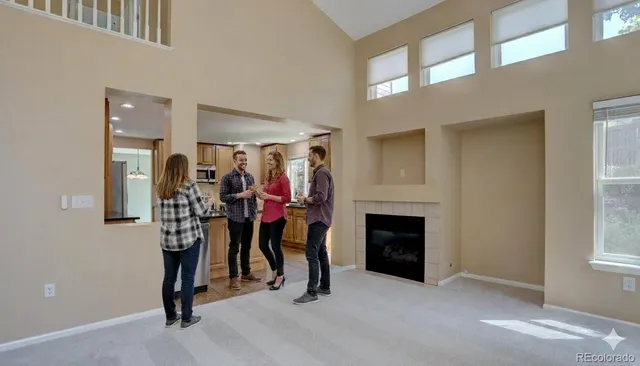 a view of a livingroom with furniture and a fireplace