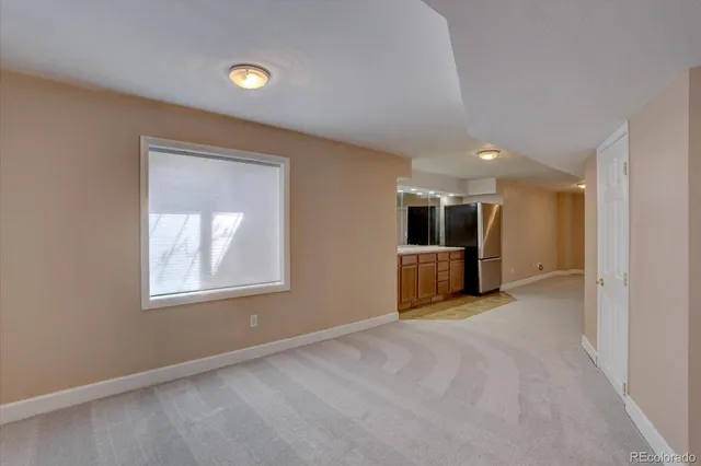 a living room with furniture a table and a potted plant
