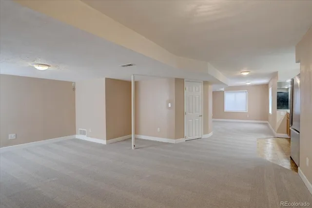 a bathroom with a sink mirror and toilet