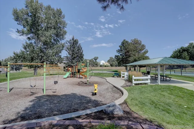 a childrens park with lots of swings and slides