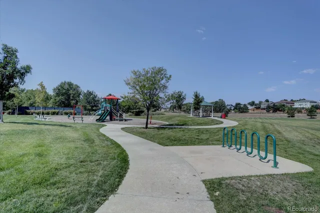a view of a backyard with a garden and entertaining space