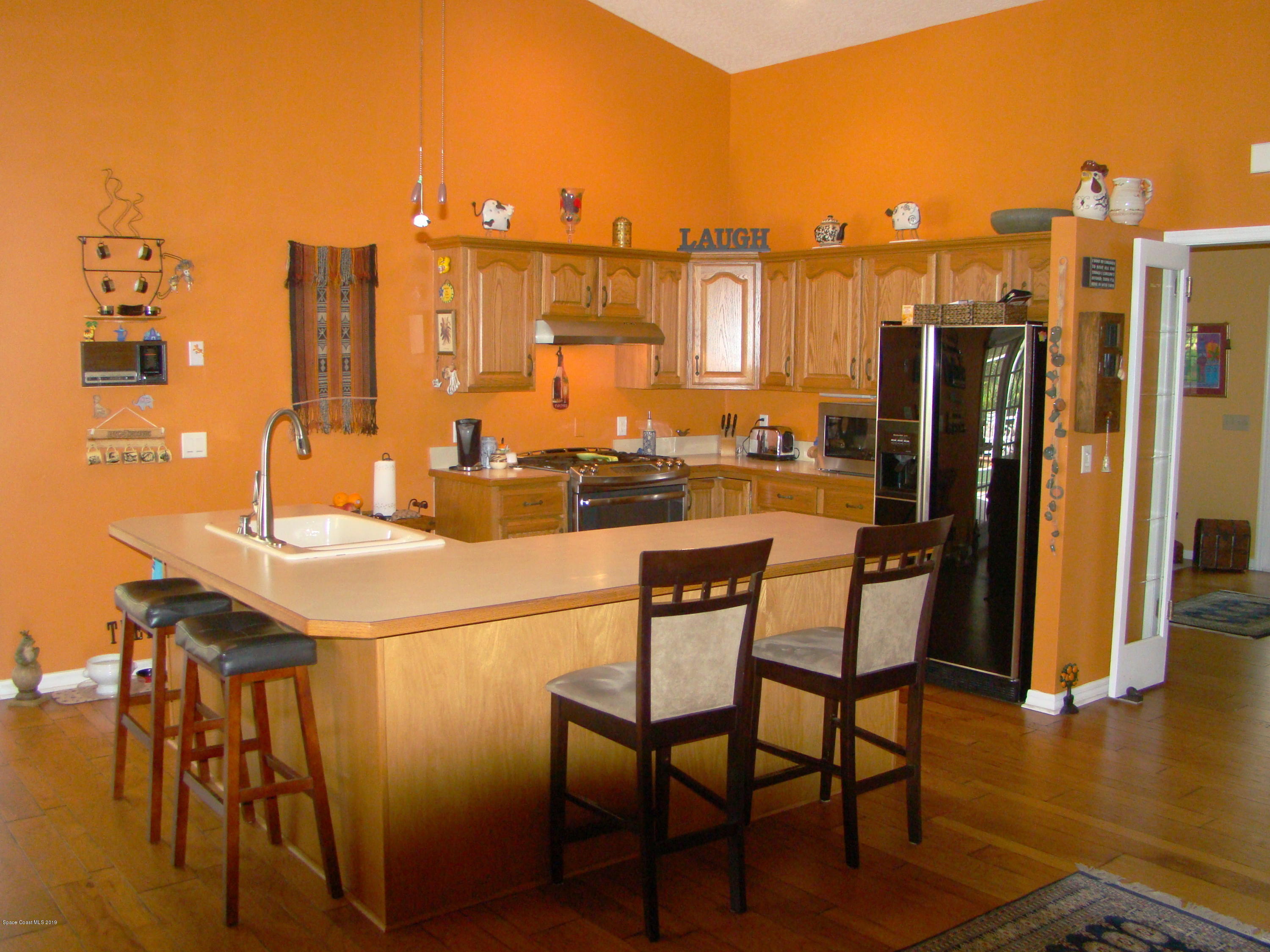 4485 Canard Road Melbourne, FL 32934 - Photo 11 of 34 CHECLK STUNNING, REAL WOOD FLOORS!