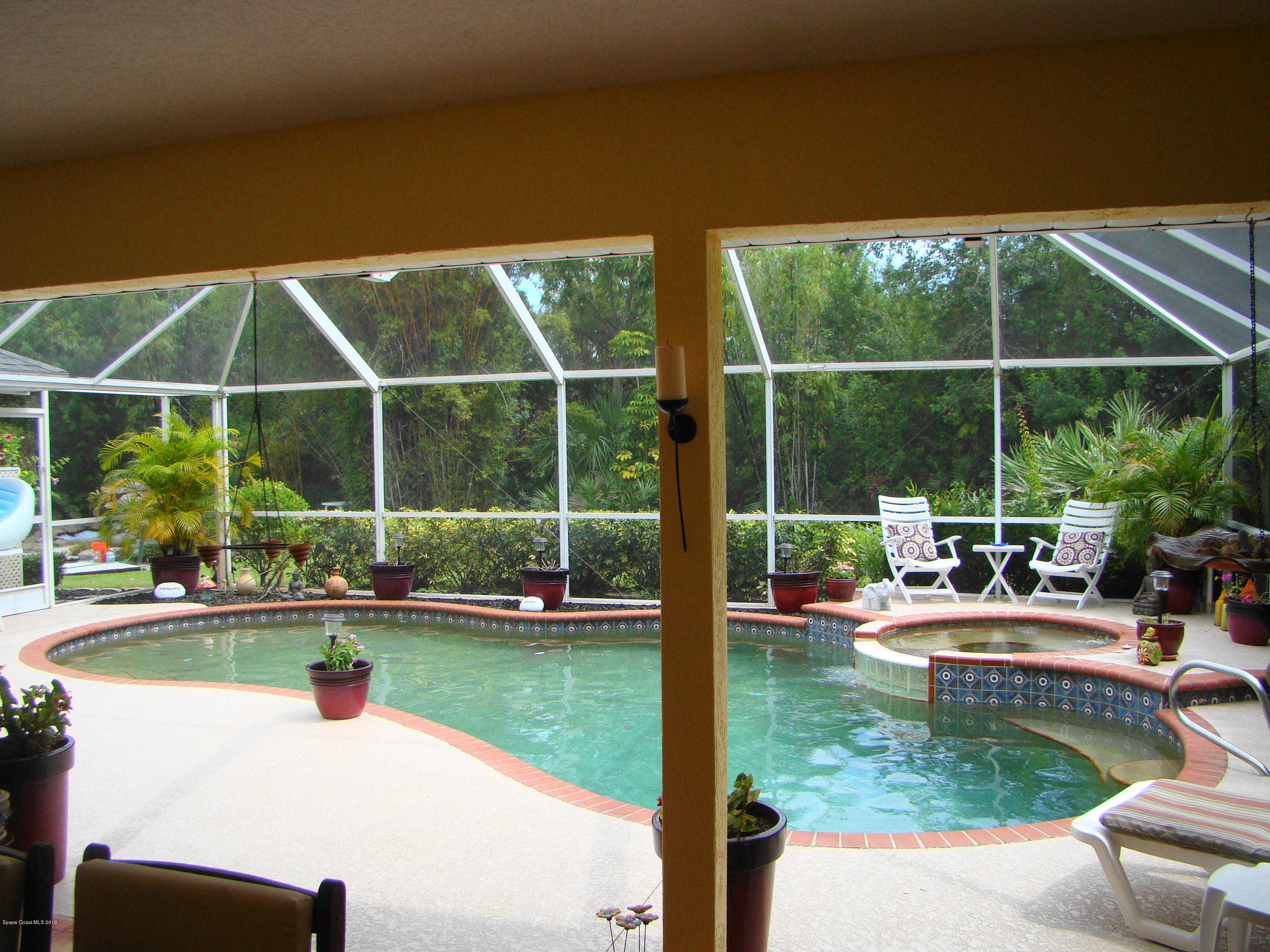 4485 Canard Road Melbourne, FL 32934 - Photo 22 of 34 SCREENED, HEATED POOL & SPA! wow!