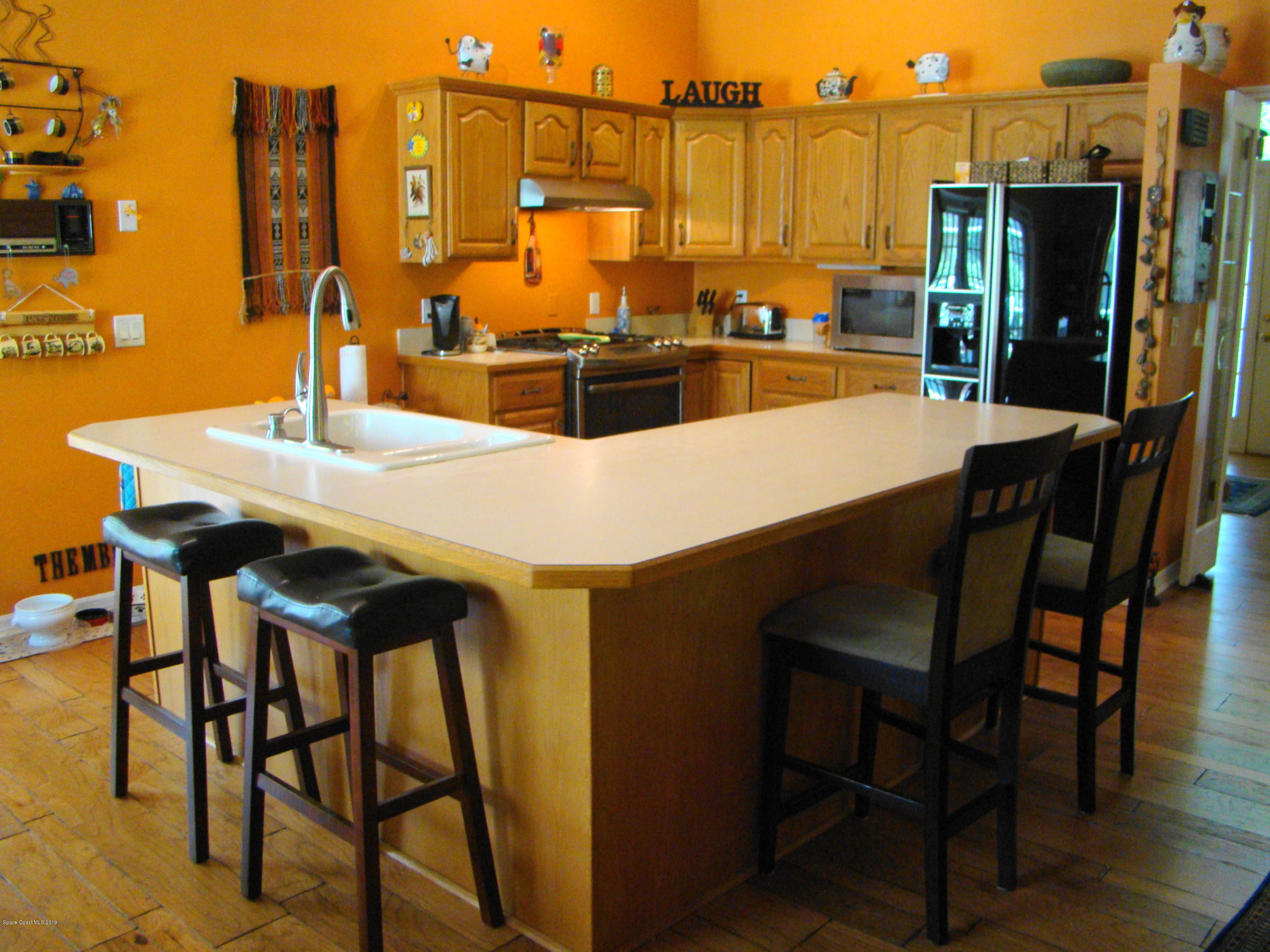 4485 Canard Road Melbourne, FL 32934 - Photo 9 of 34 KITCHEN OPENS TO GREATROOM!
