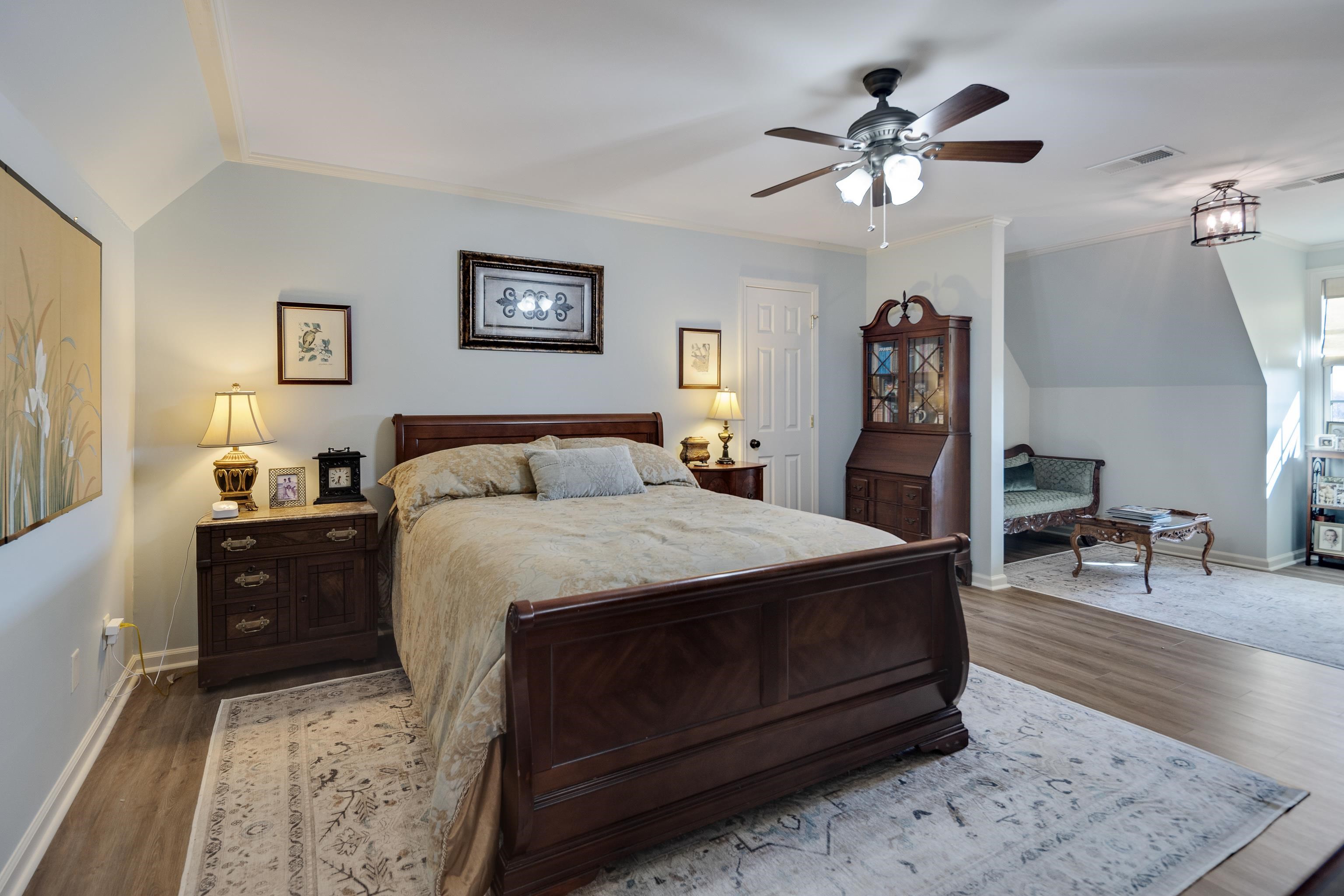 6085 Yum Yum Road Somerville, TN 38068 - Photo 24 of 40 a bedroom with a bed and a chandelier