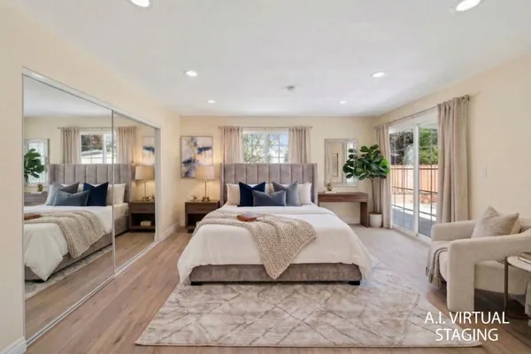 a spacious bedroom with a large bed and a couch