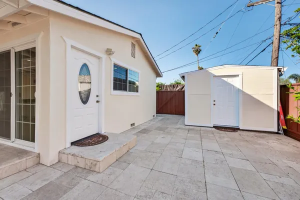 a view of a room with wooden floor and windows