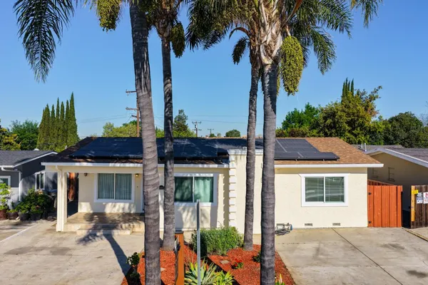 an outdoor view of house with outdoor seating