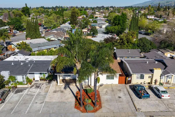 an aerial view of a houses with yard