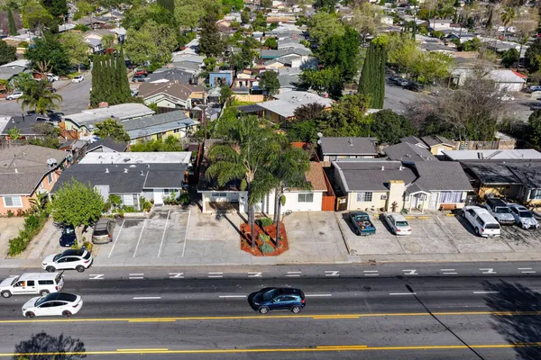 an aerial view of multiple houses with yard