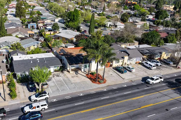 an aerial view of residential houses with yard