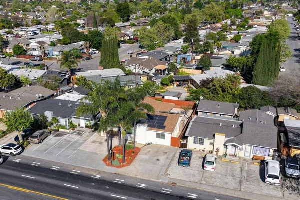 an aerial view of multiple houses with outdoor space