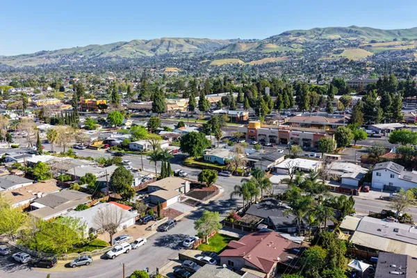 an aerial view of houses with outdoor space
