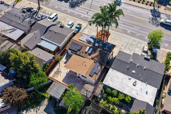 an aerial view of a house with a garden