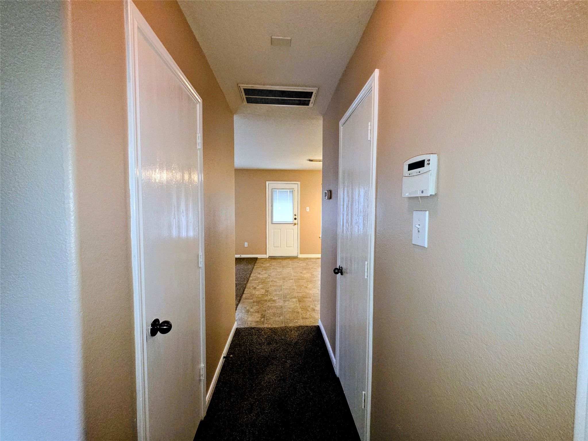 24235 Stargazer Point Spring, TX 77373 - Photo 10 of 21 a view of a hallway with a wooden door