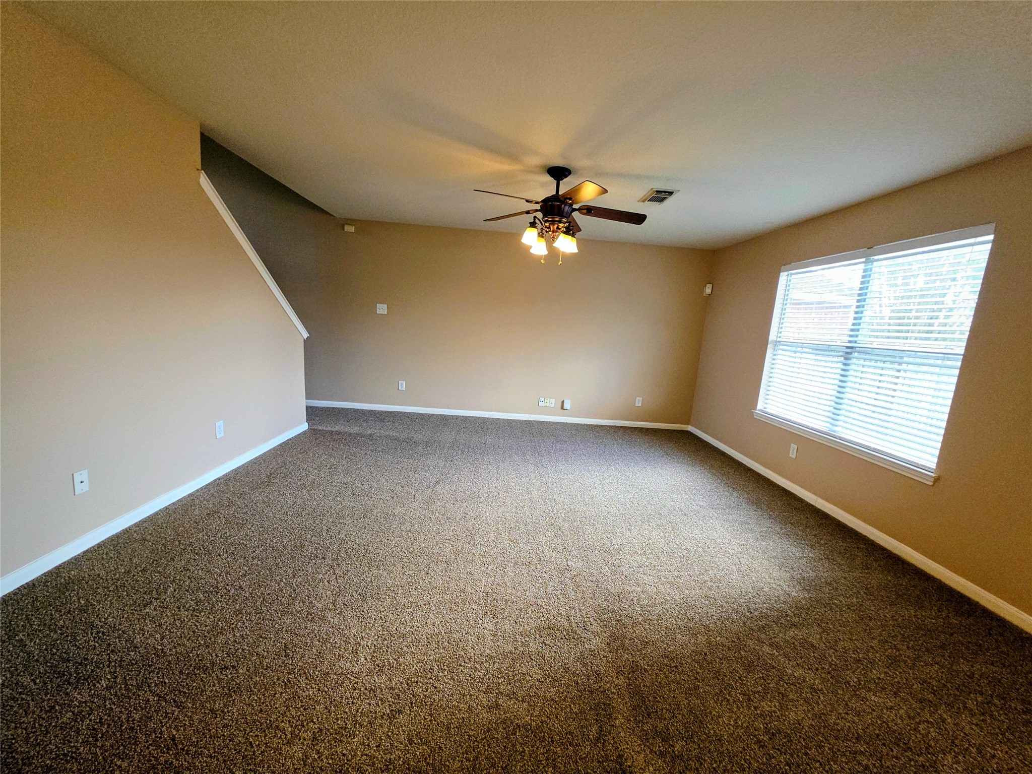 24235 Stargazer Point Spring, TX 77373 - Photo 8 of 21 an empty room with windows and fan