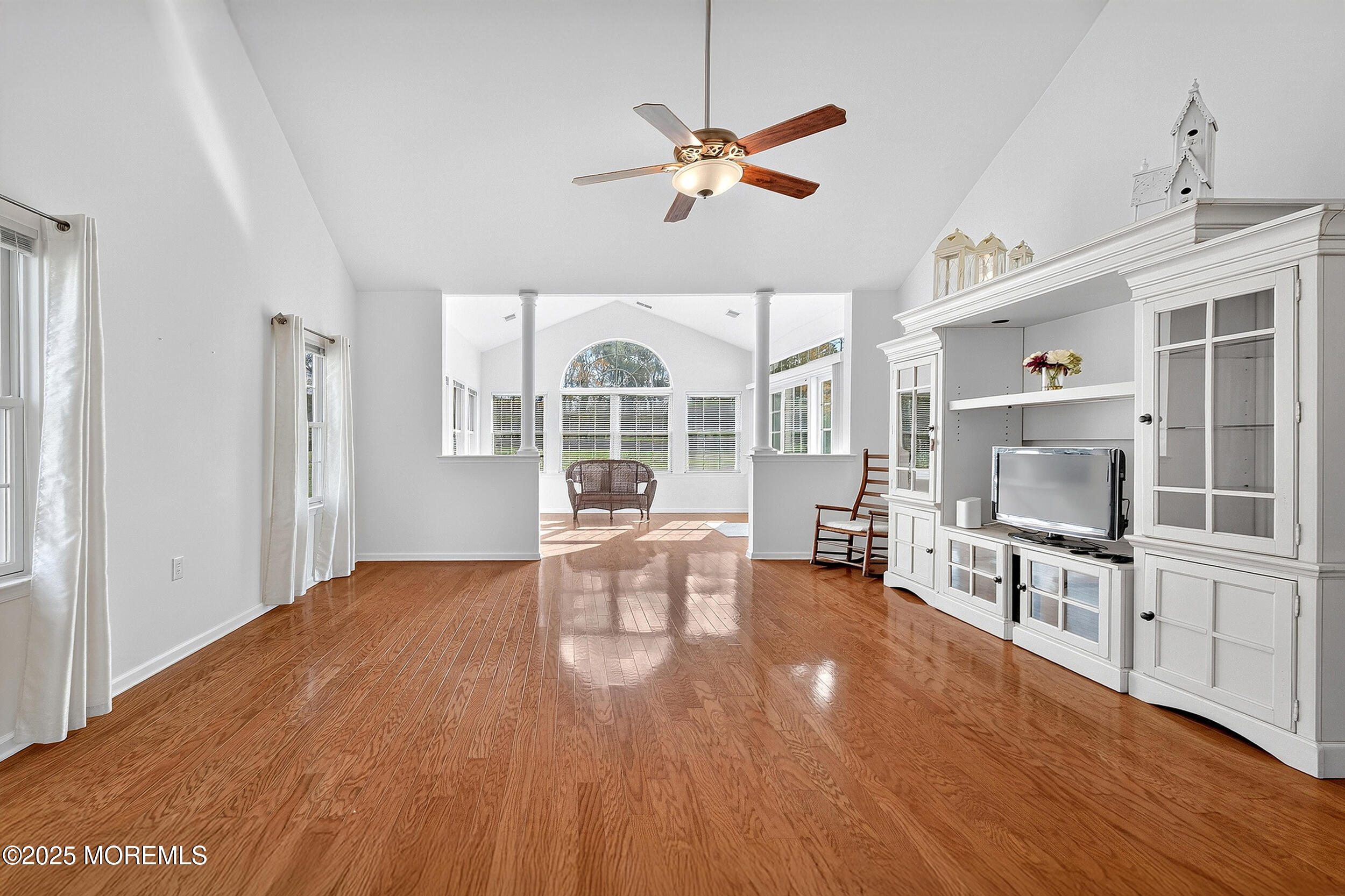 79 Spring Lake Boulevard Waretown, NJ 08758 - Photo 13 of 47 a view of a livingroom with furniture a ceiling fan and wooden floor