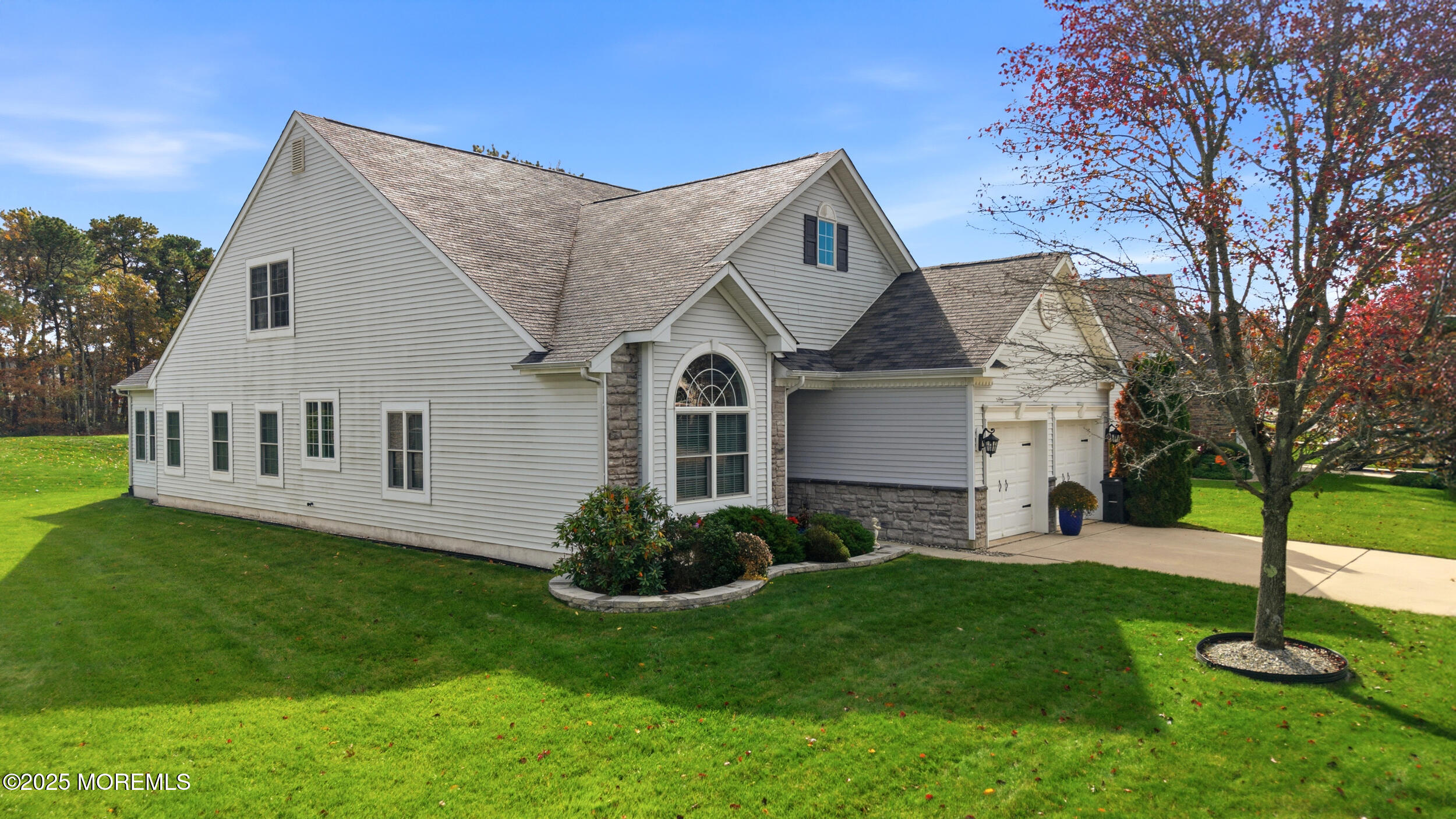 79 Spring Lake Boulevard Waretown, NJ 08758 - Photo 2 of 47 a front view of a house with a garden