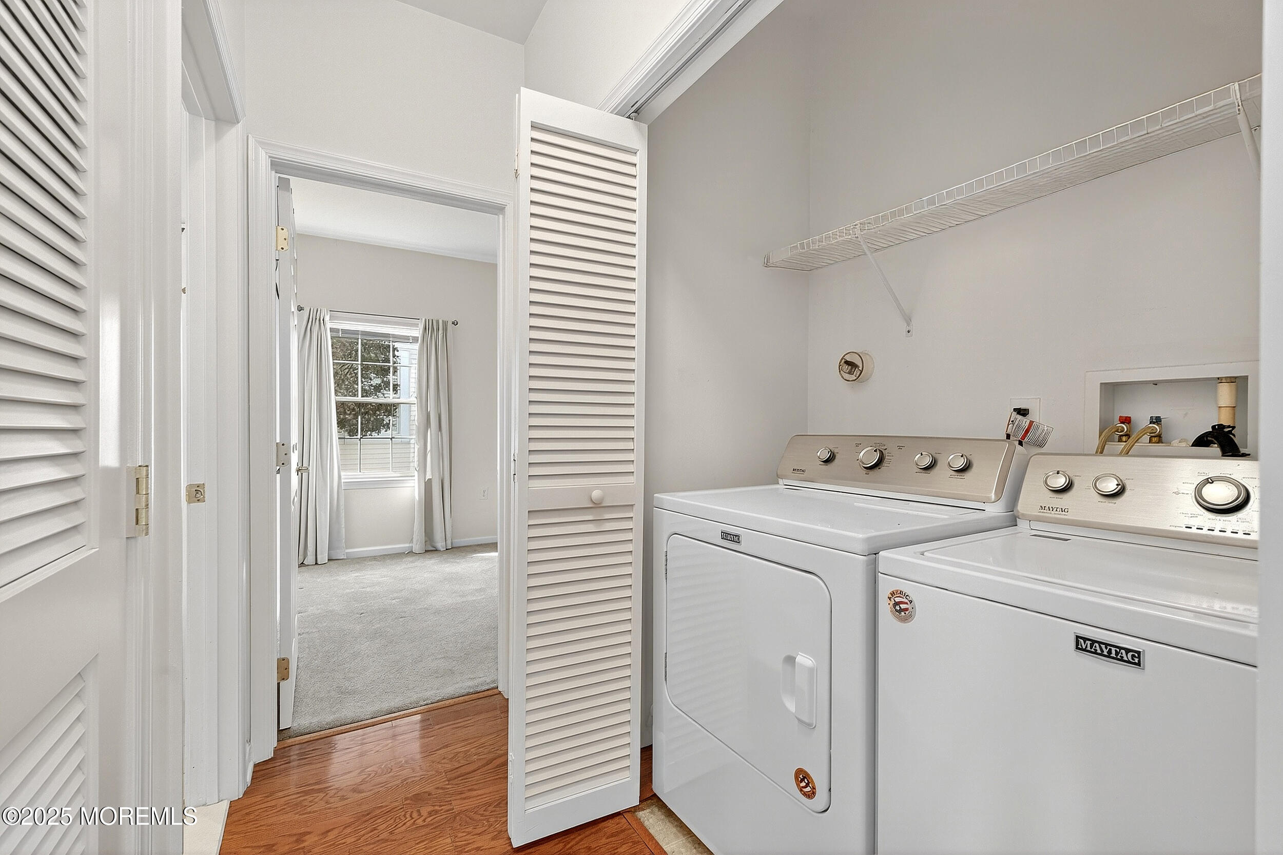 79 Spring Lake Boulevard Waretown, NJ 08758 - Photo 28 of 47 a view of washer and dryer with bathroom in the background