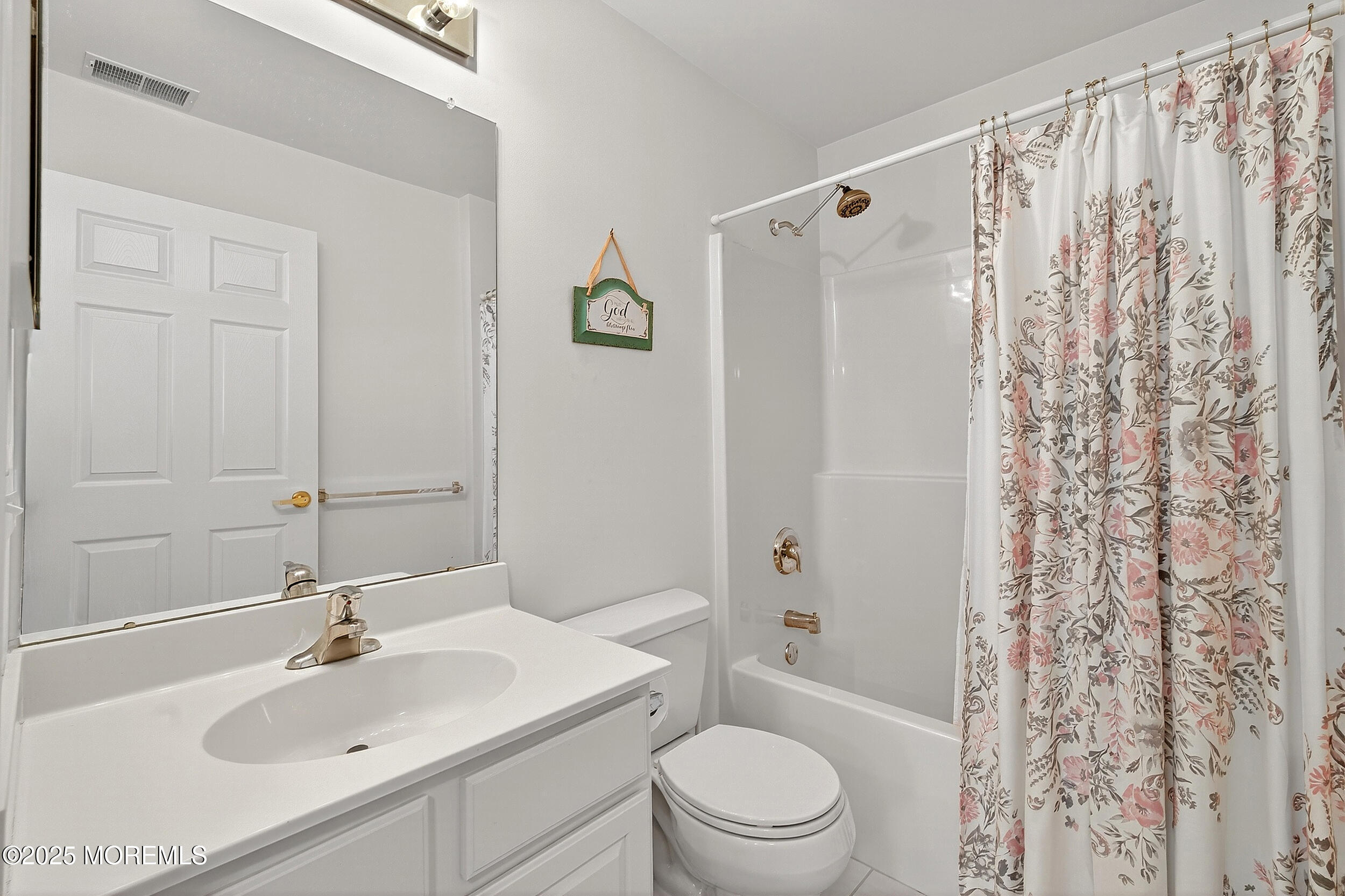 79 Spring Lake Boulevard Waretown, NJ 08758 - Photo 35 of 47 a bathroom with a sink a toilet and shower curtain
