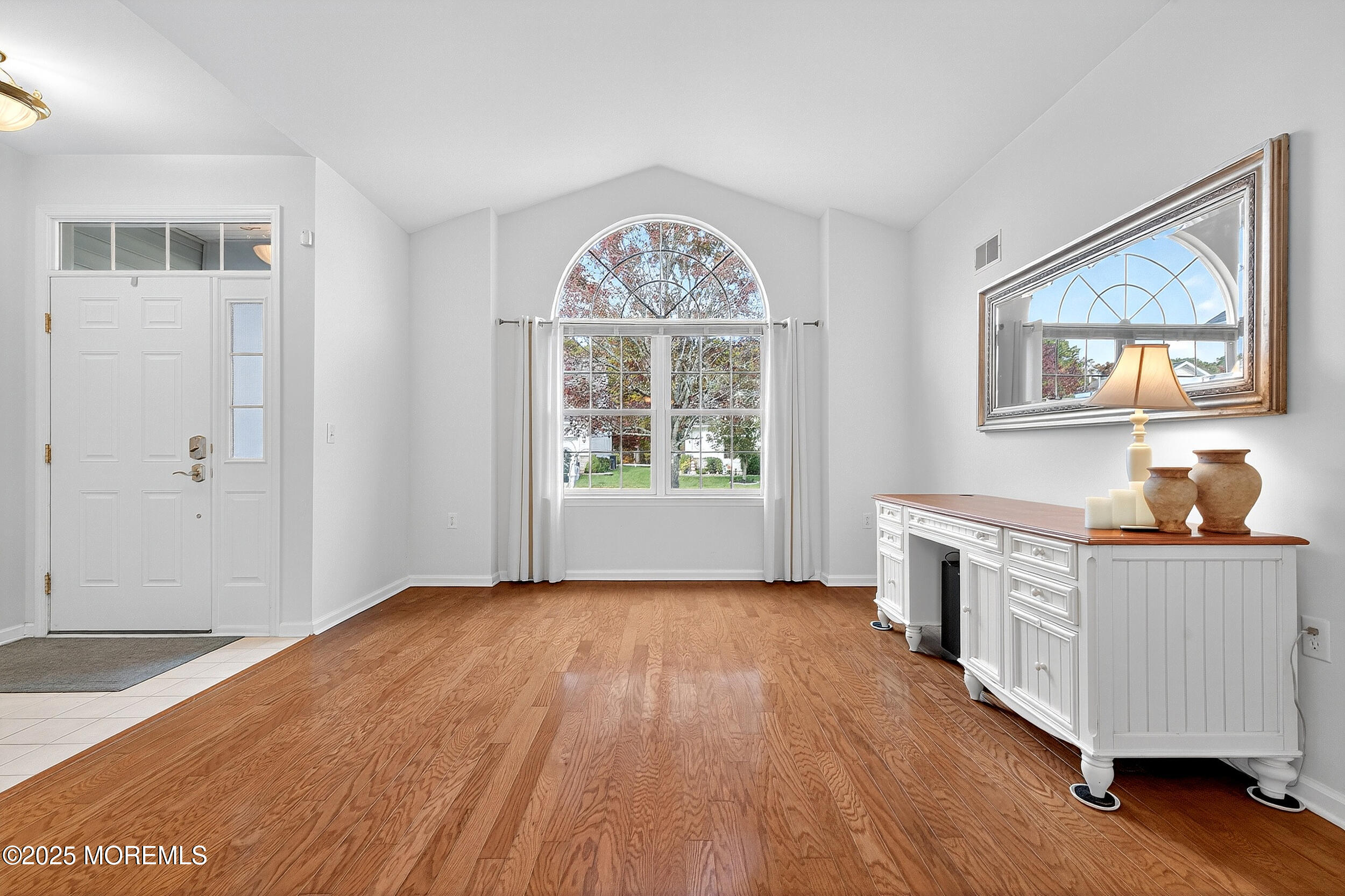 79 Spring Lake Boulevard Waretown, NJ 08758 - Photo 6 of 47 an empty room with wooden floor and a window
