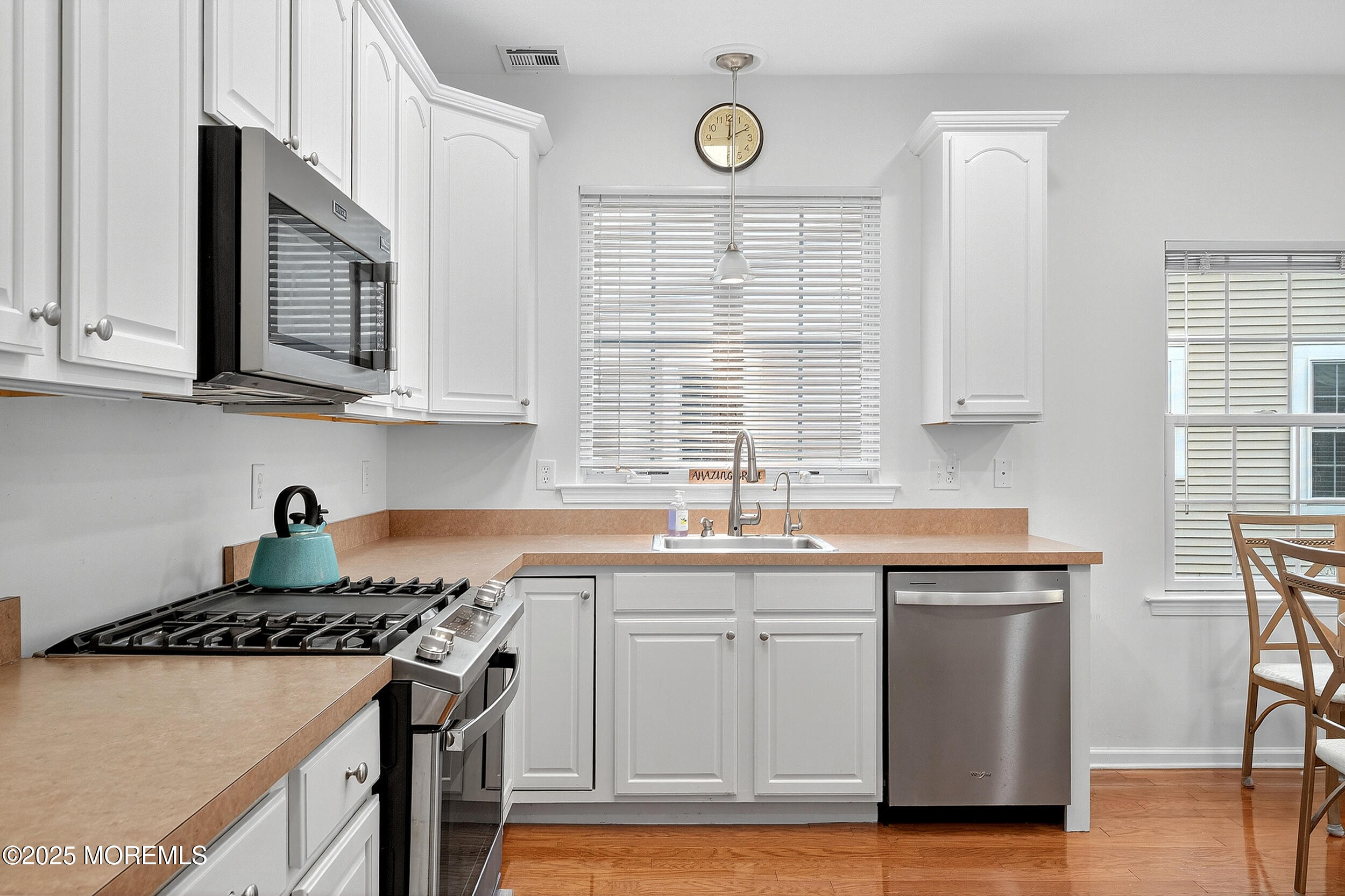 79 Spring Lake Boulevard Waretown, NJ 08758 - Photo 10 of 47 a kitchen with stainless steel appliances granite countertop a sink stove and cabinets