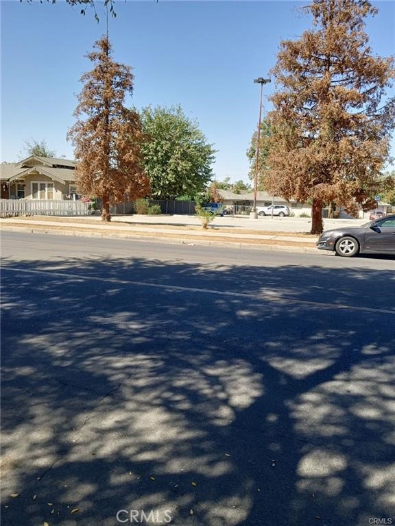 1810 Baker Street Bakersfield, CA 93305 - Photo 4 of 5 a view of yard with green space and wooden fence