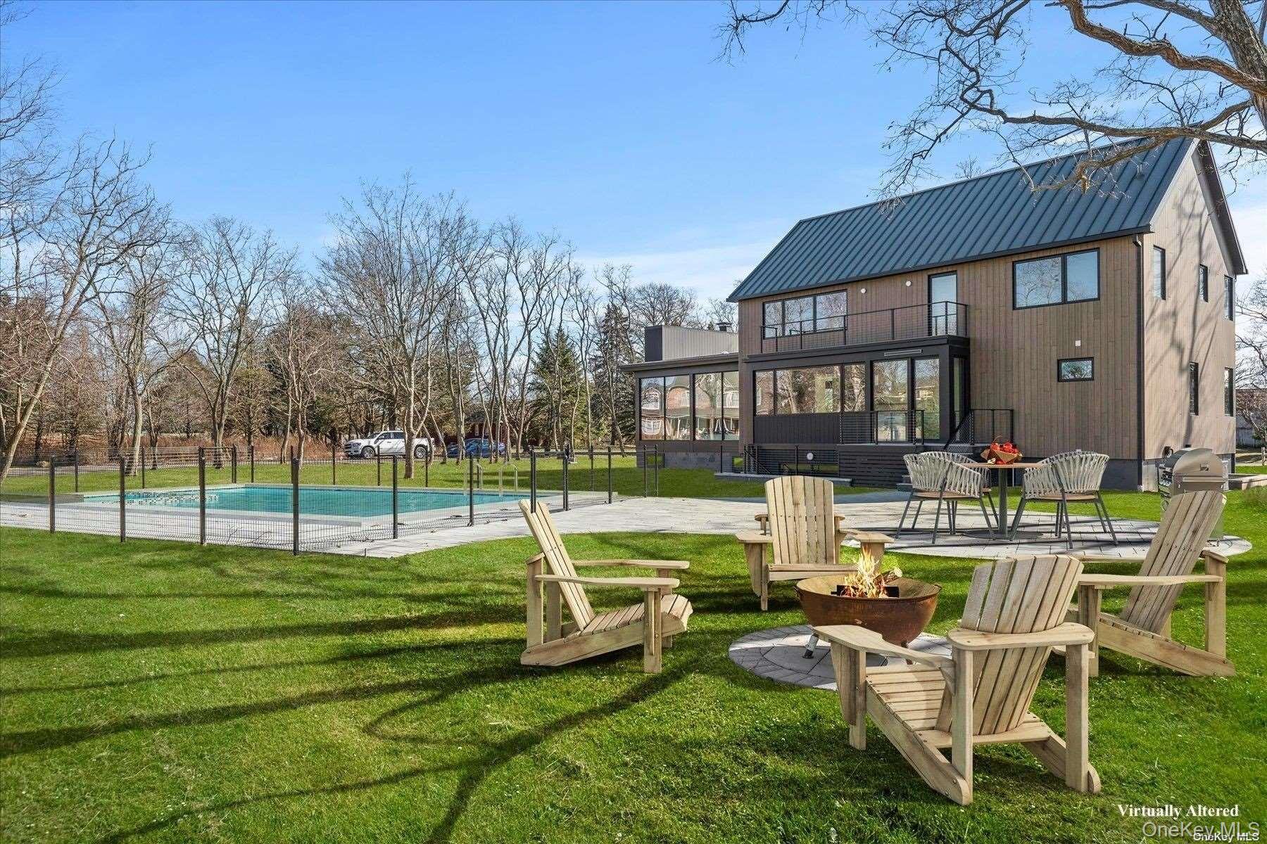 290 Windward Road Orient, NY 11957 - Photo 30 of 31 a view of a house with a backyard and a patio