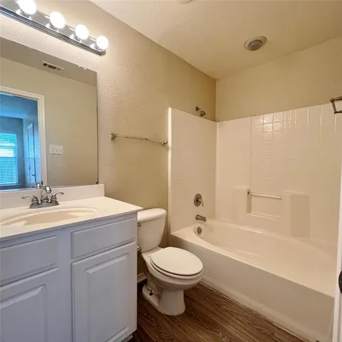 a bathroom with a toilet a sink and a bathtub